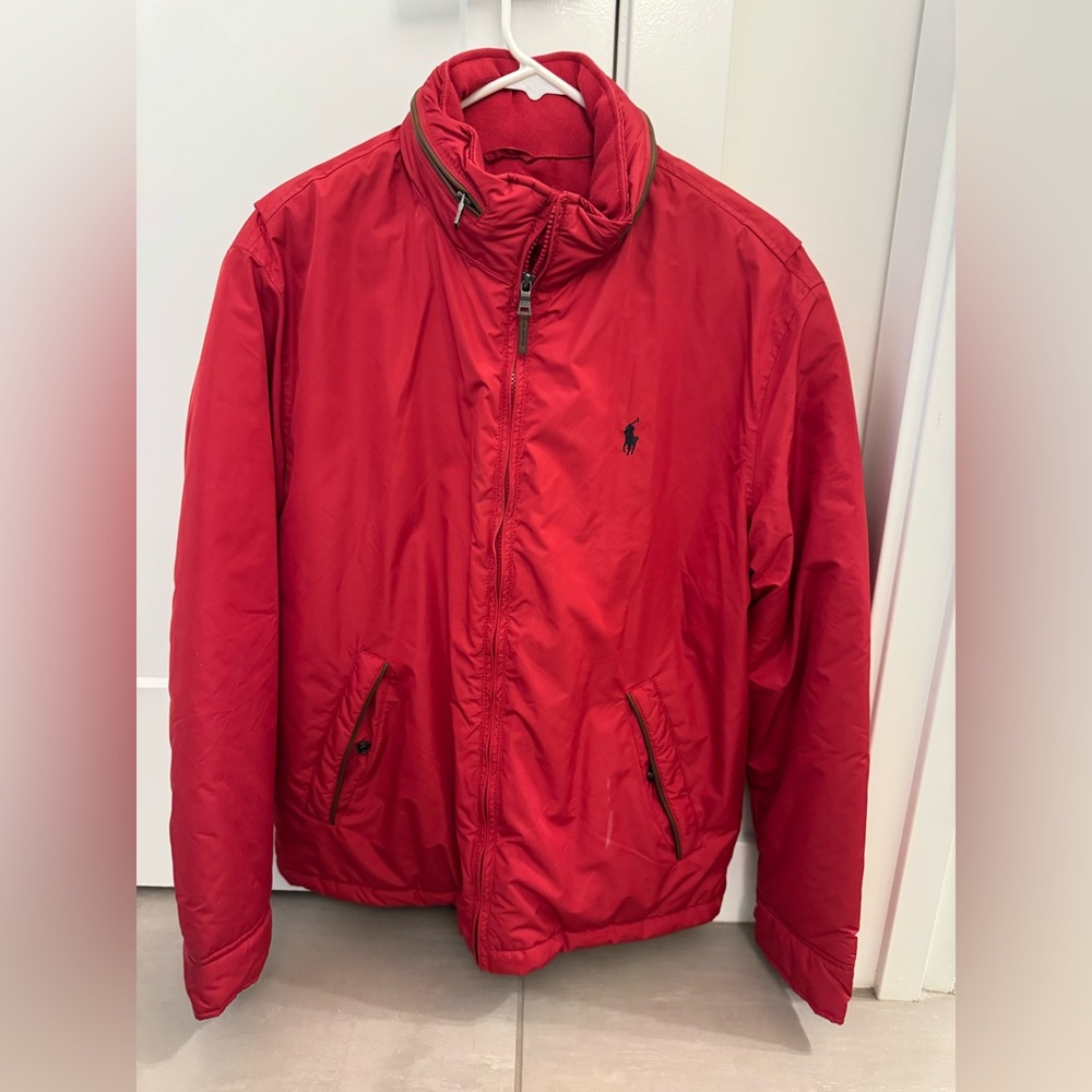 Red Polo jacket. The inside has a fleece lining for warmth.